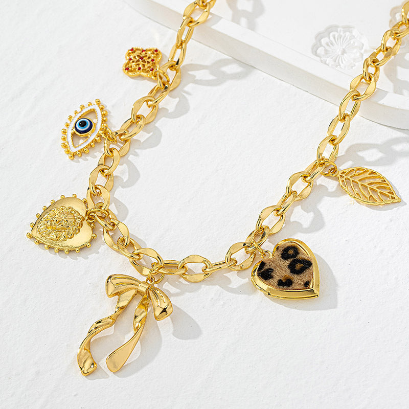 Bowknot Heart Pendant Necklace with Eye and Leaf Design – Lytton